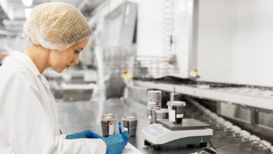 Woman working at ice cream factory pj94akq